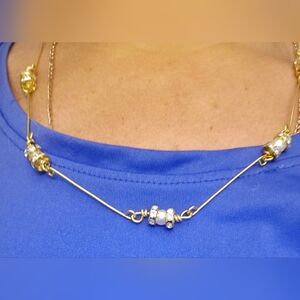 Elegant Gold Necklace with Silver Accents